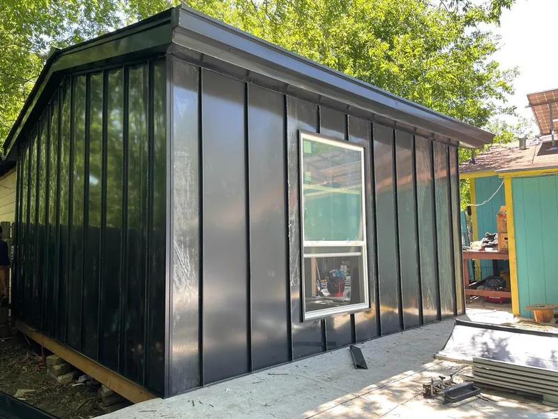 Black standing seam metal wall panels for Roof Inspection in Webb City